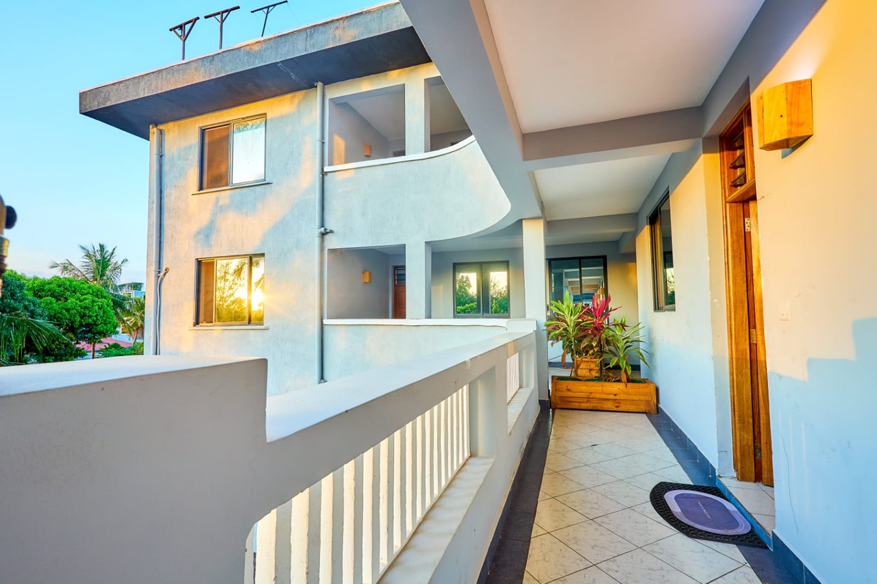Golden-hour apartment walkway at Diani Hideouts