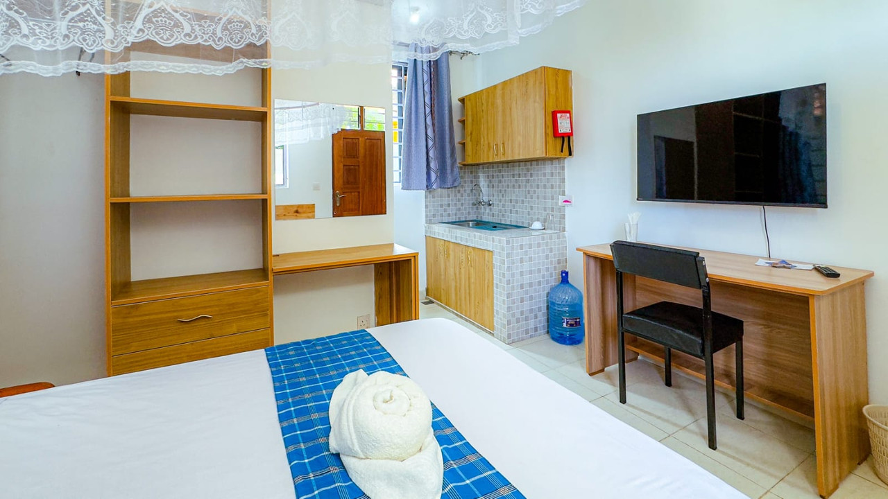 Bed, desk and Smart TV