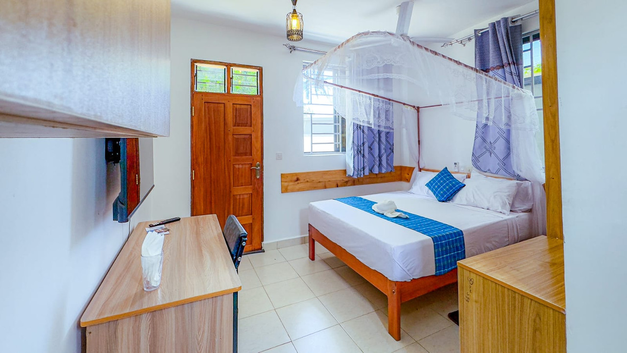 Open-plan bed and desk
