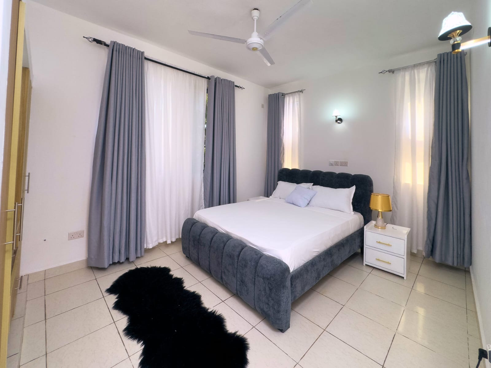 Queen bedroom with curtains